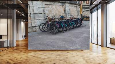 Parking bikes  on the European street Wall mural