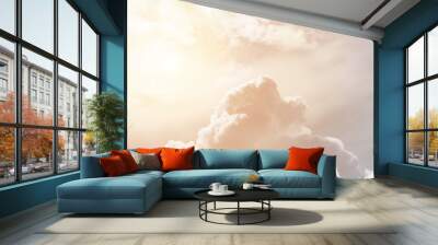 Soft cumulus fluffy clouds illuminated by the sun against a orange sky (background, toned) Wall mural