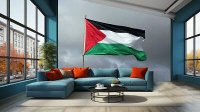 The Palestinian flag waving in the wind against an overcast dramatic dark sky Wall mural