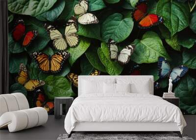 A vibrant display of butterflies on lush green leaves celebrating nature s color diversity Wall mural