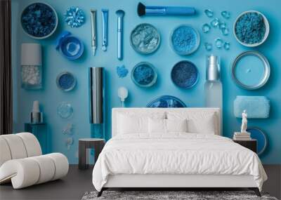 Blue beauty and skincare products flat lay on vibrant blue background composition Wall mural