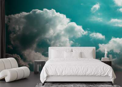 White cotton wool clouds on a sunny day. A continuous stream of clouds across the summer sky. Wall mural