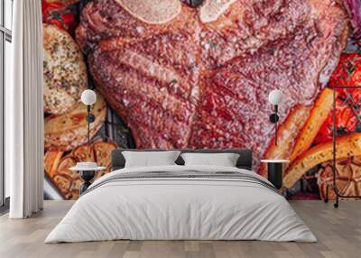 a piece of fresh bone meat butcher is fried in a pan Wall mural