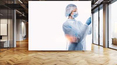 female doctor in medical mask on the face and gloves on a white background Wall mural