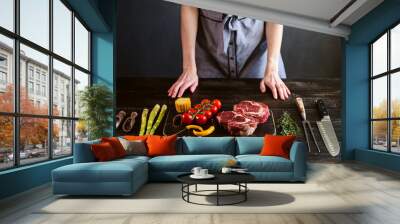 set for cooking a festive dinner for two. two raw marbled beef steaks, spices, vegetables Wall mural