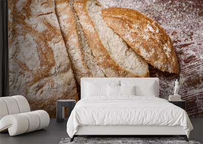 sliced bread on a wooden table. fresh baking concept Wall mural