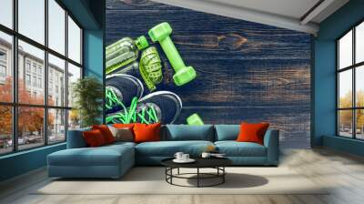 Sneakers dumbbells and a bottle of water. Flat view. All in one color. Wall mural