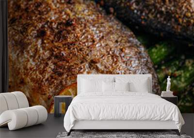 the concept of a delicious dinner for two from dorado. baked dorado fish with asparagus and lemon in spices Wall mural