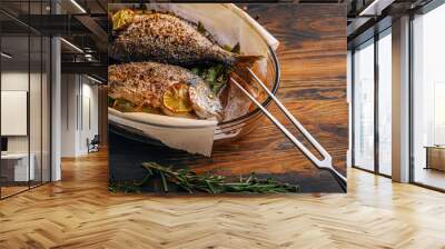 the concept of a delicious dinner for two from dorado. baked dorado fish with asparagus and lemon in spices Wall mural