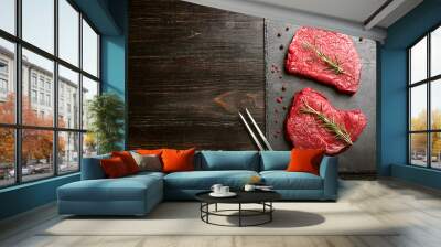 two pieces of fresh meat on a wooden table Wall mural