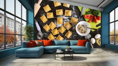 Woman chef cooks step by step the traditional ravioli Wall mural