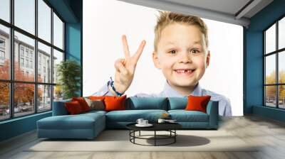 happy funny cute boy without front teeth showing hand gesture Wall mural