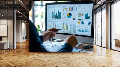 Business finance data analytics  male worker analyzing graphs and charts on computer screen Wall mural