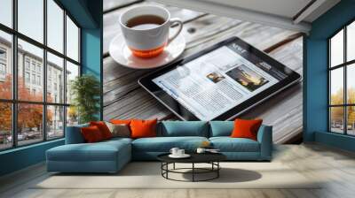 Fictional news website displayed on digital tablet with inventive stories for online browsing Wall mural