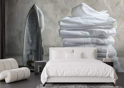 Stack of clean sheets and surgical clothes with industrial iron in industrial laundry Wall mural