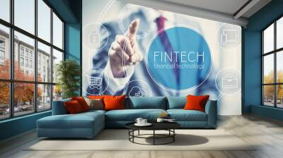 Future of financial technology concept businessman selecting fintech word Wall mural