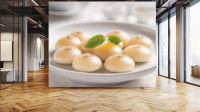 A plate of sweet dumplings sits on a white tablecloth Wall mural