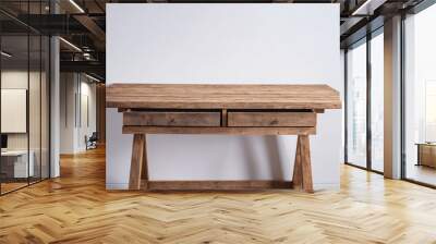 A rustic wooden desk with two drawers sits in front of a white wall Wall mural