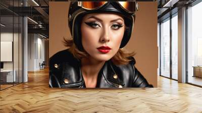 A woman wearing a black leather jacket and a helmet with goggles looks directly at the camera Wall mural