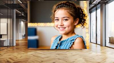 A young girl smiling and looking at the camera. Wall mural