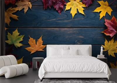 Autumn leaves are arranged on a blue wooden surface Wall mural