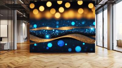 Golden ribbons lie on a blue sparkly surface with blurred yellow lights in the background Wall mural