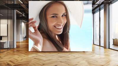 Smile, portrait and woman at pool with hat, sunshine and and travel for summer holiday at hotel. Relax, water and face of happy girl on luxury vacation with adventure, weekend and swimming in sun Wall mural