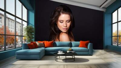 Alluring beauty. A cropped shot of a beautiful young woman isolated on black. Wall mural