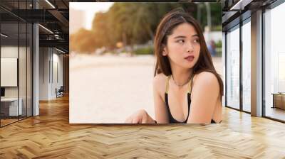 Asian beautiful woman enjoyful on the beach background. Wall mural