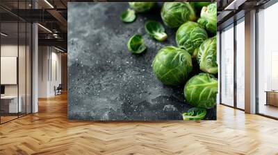  A black table holds two piles of Brussels sprouts Wall mural