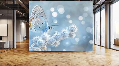  A close-up of a butterfly on a plant with a backdrop of bokeh  of lights, and a blurred foreground of snowflakes Wall mural