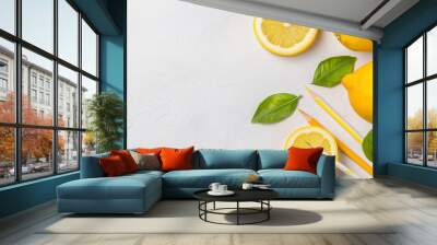  A collection of lemons on a table, accompanied by two chopsticks and two lemons Wall mural