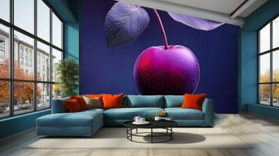  A fruit, tightly focused, dangles from a leafy branch against a dark blue backdrop Background softly blurred Wall mural