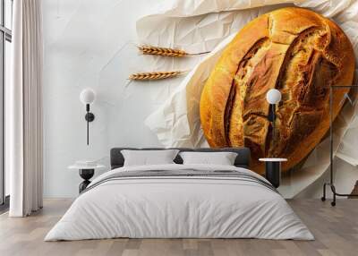   A loaf of bread on a table, with one paper beneath it Wall mural