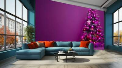  A purple Christmas tree with presents beneath, on a shiny surface; star-topped, against a purple wall Wall mural