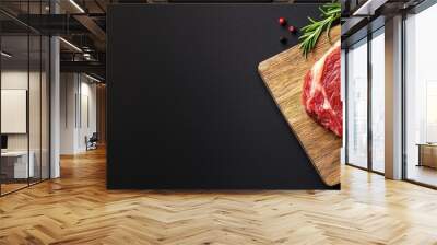  A raw meat slice rests atop a wooden cutting board, surrounded by tomatoes and a nearby pepper shaker Wall mural