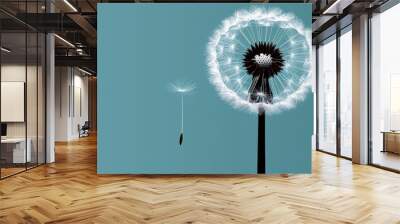  A solitary dandelion floats in the wind against a blue backdrop, while two more dot the foreground Wall mural