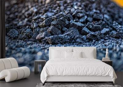  A stack of blue rocks supporting a stack of black rocks atop a pile of wood Wall mural