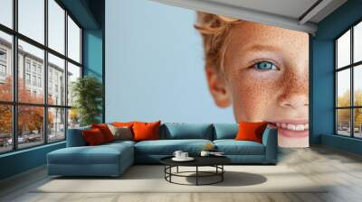  A tight shot of a child's face adorned with freckles Wall mural