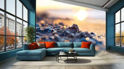  A tight shot of a rock on the beach, sun sinking behind, ocean backdrop Wall mural