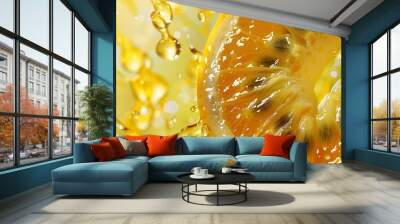  A tight shot of a sliced orange, adorned with water beads on its exterior and interior, against a backdrop of sunlit yellow water droplets Wall mural