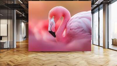  A tight shot of several pink flamingos amidst a sea of pink blossoms Wall mural