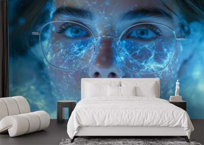 a close up of a woman's face with blue light coming out of her eyes and a pair of glasses in front of her face. Wall mural