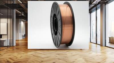 Copper welding wire spool for industrial and commercial use on a white background – close-up view of precision engineered wire on durable plastic reel high-quality. Wall mural