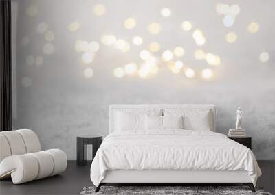 blurred Christmas lights and snow. Bokeh winter background. defocused Wall mural