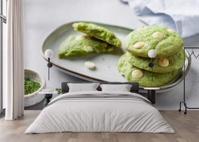 stack of green tea matcha cookies with white chocolate in plate on gray background. Health care, diet and nutrition concept. close-up Wall mural