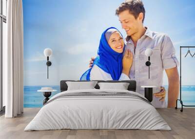 happy muslim couple on a beach Wall mural