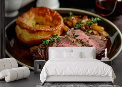 A plate of roast beef and Yorkshire pudding, a traditional Sunday roast dinner in England Wall mural