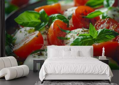 A vibrant salad featuring fresh mozzarella, ripe tomatoes, and fragrant basil leaves is drizzled with olive oil and seasoned with pepper Wall mural