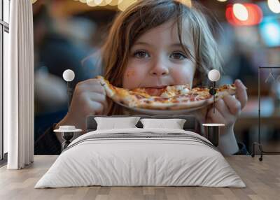 A young girl is eating a slice of pizza Wall mural